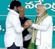 pm modi encourages chiru on stage at bhimavaram