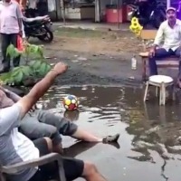 What an idea! MP residents throw party on pothole-filled road