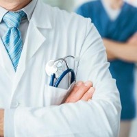 Doctors transplant patient's kidney from left to right, place both on one side