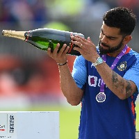 a photo of virat kohli with Champagne bottle goes viral on social media