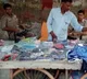 Street Vendor gets Two Gunmen Security