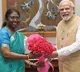 pm modi congratulates draupadi murmu at her residence in delhi