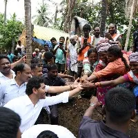 flood affected people shows playcard that says jagananna devudu