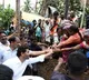 flood affected people shows playcard that says jagananna devudu
