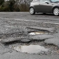 Man fell into road pothole and died