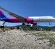 Wizz Air passenger plane skimming just yards above tourists heads