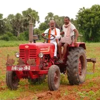 bandi sanjay rides a tractor in his padayatra