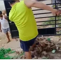 municipal employees threw severage before a house in vijayanagaram