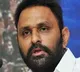 katari eshwar kumar demands to remove kodali nani photo from municipal Office