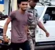 Man who set girl on fire in Dumka seen smiling in police custody