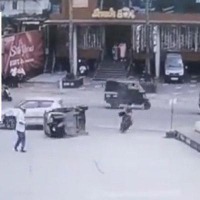 Watch: Woman narrowly escapes from being knocked down by a vehicle