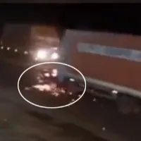 Shocking CCTV visual shows container truck dragging car following crash