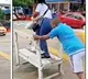 Man earns money by transporting people across waterlogged roads