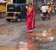 Kerala bride walks on road full of potholes