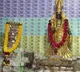Gold and currency decorated deity in Penugonda