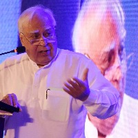 'Freezing democracy', Sibal slams EC over Sena symbol freeze