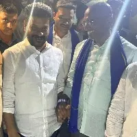 tpcc chief revanth reddy shakes hands with bsp leader rs praveen kumar in munugode bypoll campaign
