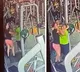 Women slap each other over gym equipment