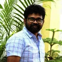 Sukumar helps a cancer patient