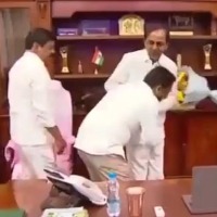 Telangana official triggers row by touching CM's feet