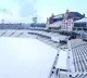 Oval cricket ground filled with snow