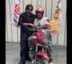 Pawan Kalyan presents a mobile phone to party worker Balaji