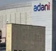 Adani group firms pledge shares for lenders of flagship company sbi cap trustee