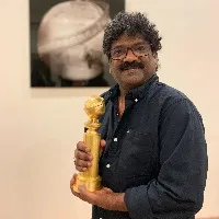 Chandrabose picks up his Goldenglobe award award