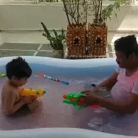 Talasani plays Holi with grandson in bath tub