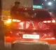 Noida: Youth sits on window of speeding car, probe underway