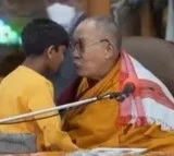 Dalai Lama 'caught' on video kissing boy on lips