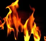 woman her self sprays kerosene and sets fire in hyderabad