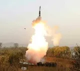 North Korea test fires new solid fuel long range missile warns of extreme horror to rivals