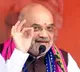 Amit shah shares video of man wiping off rain water on Modi cutout in Karnataka