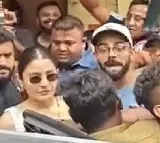 Virat gets angry after fans mob him and anuskha for selfie