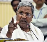Siddaramaiah take oath and sign on five assurances