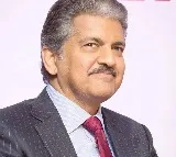 Anand Mahindra shares video of men waiting for cars to splash water on them