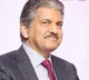 Anand Mahindra shares video of men waiting for cars to splash water on them