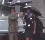 Pak minister takes umbrella away woman officer gets drenched in rain video goes viral
