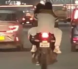 Ghaziabad police reacts to couple romance on moving bike