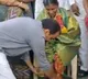 Mangalagiri MLA washes volunteer legs