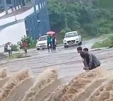 Two men trapped on swollen bridge rescued with hydraulic crane in Udaipur