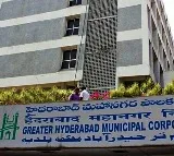 A resident releases a snake that entered his home due to rain in a GHMC ward office