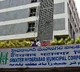 A resident releases a snake that entered his home due to rain in a GHMC ward office