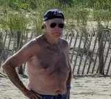 Joe Biden shirtless with baseball cap and aviators