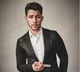 Nick Jonas falls through hole on stage while performing