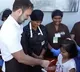Rahul Gandhi take autograph from a little girl in Ooty