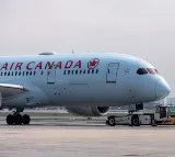 Air Canada passengers refused to sit on vomit covered seats asked to get off