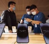 China moves to widen state employee iPhone curbs