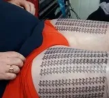 UK dad reclaims world record with 667 tattoos of daughters name